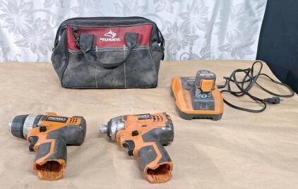 (1) Rigid 3/8" 12V Cordless Drill, (1) Rigid 12V Cordless Impact Wrench W/ Charger, (1) Battery & Toolbag