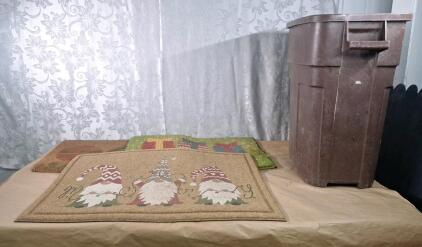 (3) Holiday Themed Entrance Mats & (1) Plastic Garbage Can