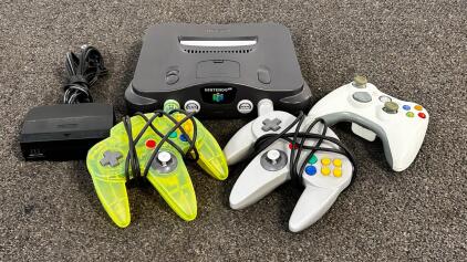 Nintendo 64 Console (Tested And Powers On) NUS-001(USA) Bundle With 2 N64 Controllers, Power Adapter, Xbox 360 Controller (Location 2)