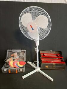 RIDGID R2601 Random Orbital Sander w/Discs, Midea FS40-8JC Stand Fan, Metal Cantilever Toolbox, both powered on.