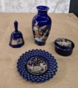 (1) Vintage 4-Piece Japanese Cobalt Blue Porcelain Set Featuring Hand-painted Peacock, Pheasant & Floral Motifs W/ Raised Gold-Gilt Accents, Includes Bud Vase, Small Decorative Bell, Lidded Trinket Box & Reticulated Decorative Plate.