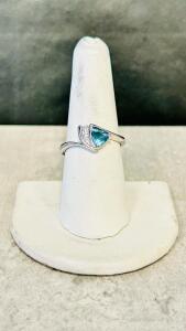Size 8 Faceted Trillion Cut Aquamarine And Diamond-Like Accent Ring