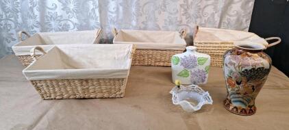 (1) 10" Japanese Satsuma Syle Porcelain Vase, (1) 7" Floral Porcelain Vase, (1) 7" Milk Glass Basket, (4) Woven Grass Storage Baskets, 16" x 12" x 6"