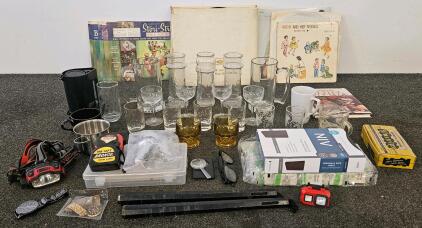 35mm film strips, assorted glassware including beer mugs, nunchucks, two watches, large package of travel soaps, vintage records, headlamps and more
