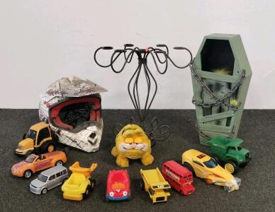 Mixed Lot: 12 Toy Vehicles, Off-Road Helmet, Garfield Plush, Halloween Decor, Metal Stand