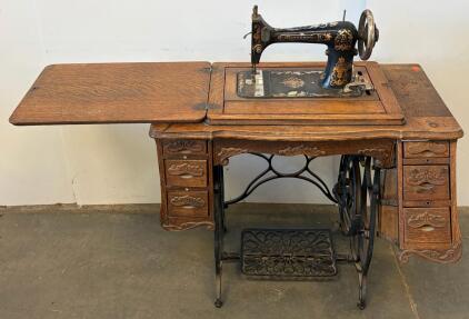 Minnesota Model A Treadle Sewing Machine With Ornate Oak Cabinet And Cast Iron Base