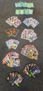 Mixed Lot 1990s-2020s NFL Football Cards &ndash; Wild Card, Monsters of the Gridiron, Super Bowl Trivia, Tua Tagovaila, Sam Darnold, Tyler Murray, Josh Downs, Brett Farve, Herman Moore, and many more