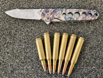 Buck 1831 Folding Knife Camo Handle with 6x Winchester .300 Win Mag Super-X Cartridges