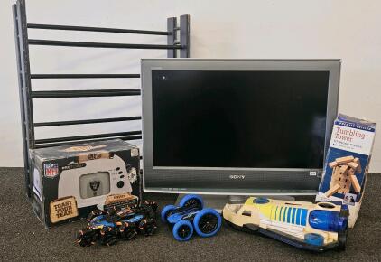 Sony Bravia KDL-26S2000 26" LCD HDTV, 1366x768, HDMI, Made in Japan, March 2006, SN: 7011334 (missing cord), NFL Raiders toaster (new in box), tumbling towers game, CD/DVD rack, toy trucks and airplane (J)