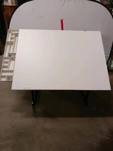 Adjustable Drafting Table with Tilted White Tabletop, Black Metal Frame, and Organizer Tray