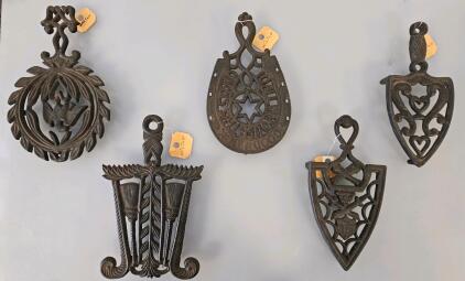 Set of 5 Wilton Cast Iron Trivets &ndash; Various Designs, 1950s-1980s, 8.5" x 4.5" Each