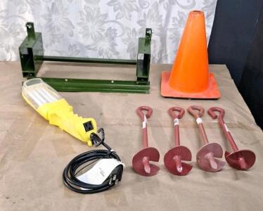 (1) Fluorescent Worklight W/ Outlet, (4) 15" x 3" Iron Earth Anchors, (1) Iron Support Bracket & (1) Small Orange Cone