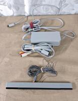 (1) Wii Console W/ Stand, (2) Remote Controllers, (1) Nunchuk Controller, Sensor Bar, AC Adapter & AV Cable, (1) Balance Board & (3) Games - 5