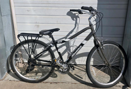 Novara Jaunt Hybrid Comfort Bike, 6061 Aluminum Frame, 26" Wheels, Rear Rack, 21-Speed