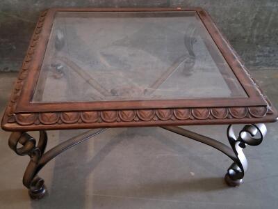 Square Glass-Top Coffee Table with Ornate Metal Legs and Carved Wood Frame