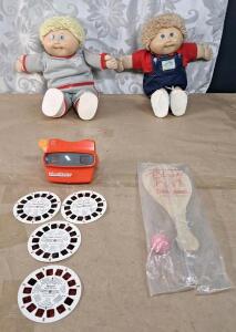 (2) Vintage Cabbage Patch Kid Dolls, (1) Vintage 3D View-Master W/ (4) Slide Disks & (1) Vintage 1988 Disneyland "Blast to the Past" Paddle Ball