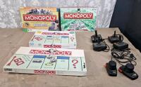 Lot Of (4) Assorted Monopoly Board Games, (3) Atari Joystick Controllers & (1) Pair Of Atari Paddle Controllers
