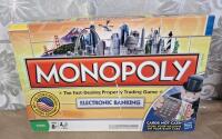 Lot Of (4) Assorted Monopoly Board Games, (3) Atari Joystick Controllers & (1) Pair Of Atari Paddle Controllers - 2