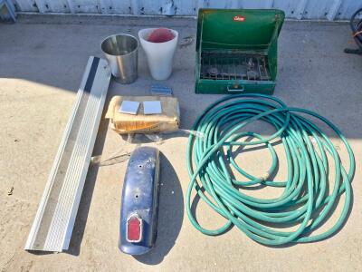 Vintage Coleman Two-Burner Camping Stove &ndash; Green Steel, Compact Design, garden hose, motorcycle fender, trash cans, box of white tiles and more