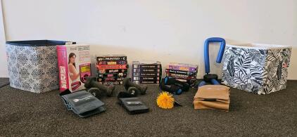 Exercise equipment including five weight sets, abdominal microcurrent shaping set, VHS tapes including complete series of Wild Blue Yonder, and more (H)