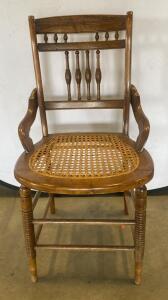 Antique Cane Seat Armchair, Spindle Back, Curved Arms, Circa 1890&ndash;1930, Ornate Woodwork 33&rdquo; Tall