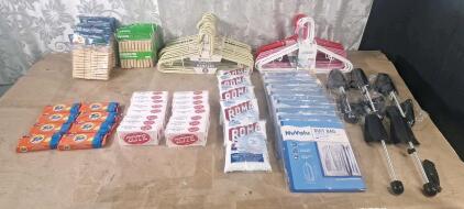 (8) Tide Blue Bar Detergent Packs, 7-Oz, Lemon Scent, (16) Zote Pink Laundry Soap Bars, 7-Oz, (5) 8-Oz Bags Of Roma Laundry Detergent, (10) Suit Bags, (4) Pair Of Men's Shoe Trees, (11) 6-Packs Of Plastic Hangers, (9) 20-Count Packs Of Bamboo Clothespin