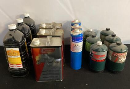 Assorted Camping Fuel Canisters: Lamp Oil, Coleman White Gas, Disposable Propane