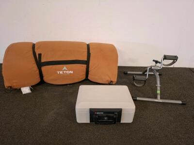 Camping sleeping pad. Sentry 1100 Portable Fire Safe Box, UL 1/2-Hour 1550&deg;F Rated, 14.3"x11.2"x6.1", Serial AA632322. Seated bicycle exercise machine.