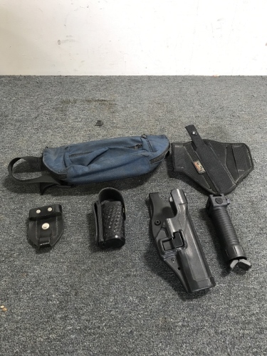 (2) Gun Holsters (1) Tex Shoemaker Baton Holster (1) Tex Shoemaker Badge Holder(1) Grip Pod Systems Gun Grip