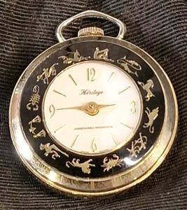 (1) Vintage Swiss Made Heritage Gold Tone Black Enamel Zodiac Pocket Watch