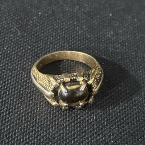 Vintage Gold-Tone Ring with Dark Oval Cabochon and Ornate Prong Setting