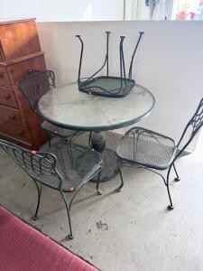 Black Wrought Iron Outdoor Patio Dining Set with Glass Top Table and Four Stackable Chairs