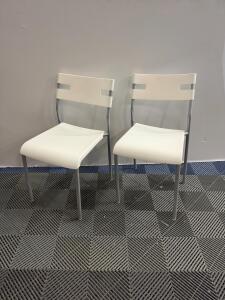 Pair of Modern White Plastic and Metal Side Chairs, Slotted Back, 30.5" Height, Minimalist Design