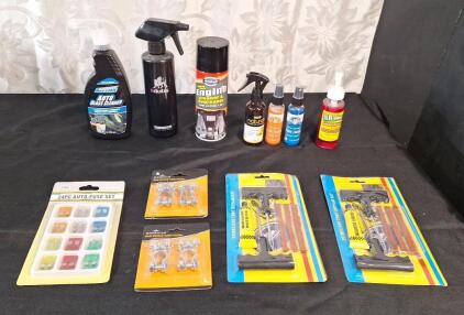 (1) 24-Piece Auto Fuse Kit, (2) 2-Packs Of Auto Battery Cable Terminal Clamps, (2) Tubless Tire Repair Kits, (1) Spray Bottle Of Glass Cleaner, (1) Spray Bottle Of Tire Cleaner, (1) Spraycan Of Engine Degreaser, (3) Spray Bottles Of Air Freshener & (1) Sp