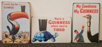 Three Guinness Signs.
