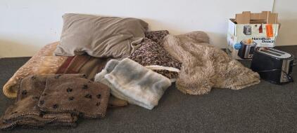 Hamilton Beach 2-Slice Toaster, Extra-Wide Slots, Stainless Steel/Black, Bagel & Defrost Settings plugged in and functioning, 6 blankets, one pillow case, and one pillow