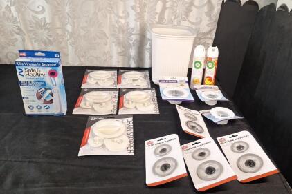 (1) UV Disinfecting Light, (5) 3-Piece Drain Stopper Sets, (4) 2-Piece Wire Mesh Sink Strainer Sets, (3) Plastic Sink Strainers, (2) 8-Oz Cans Of Air Freshener Spray & (1) Small Wastebasket