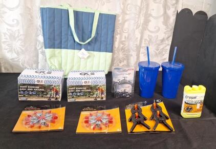 (1) Quilted Tote Bag, (2) Pair Of Kid's Sport Kneepads, (1) 20" Bicycle Tube, (2) 16-Oz Tumblers W/ Lid & Straw, (1) Small Reusable Ice Pack, (2) 6-Piece Small Spring Clamp Sets & (1) 4-Piece Small Plastic Spring Clamp Set
