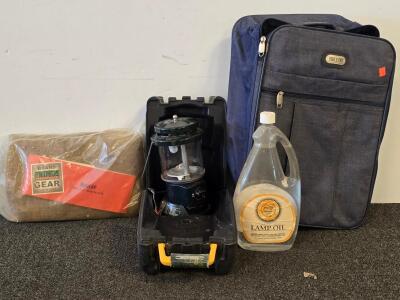 Coleman Powerhouse Dual Fuel Lantern, Lamplight 64oz Lamp Oil, Trails End Rolling Suitcase, Primos 54x12' Burlap