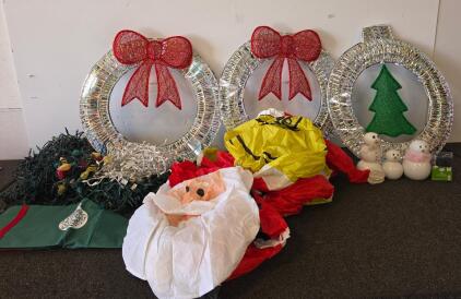 Mixed Christmas Decoration Lot: 2 Large Pre-Lit Wreaths, one pre-lit ornament. all three are functioning, Inflatable Santa & Grinch, Ceramic Snowmen, String Lights, some lights functioning some arent and a Storage Bag