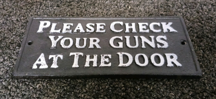 Cast-Iron Sign "Please Check Your Guns at the Door"