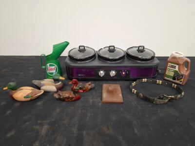 BELLA Triple Slow Cooker 2.5 Qt x3, ( powered on) Castrol Jug, Duck Decoys, Deer Attractant, Leather Belt Lot. ( shelf I)