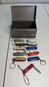 Collection of 11 Promotional Pocket Knives w/ Victorinox, Wood Handle & Metal Storage Box