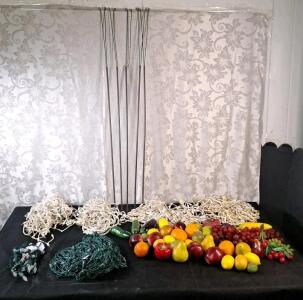 (6) Assorted Legnth Strands Of Christmas Lights, (5) 48" Support Stakes & (30+) Assorted Pieces Of Artificial Fruit