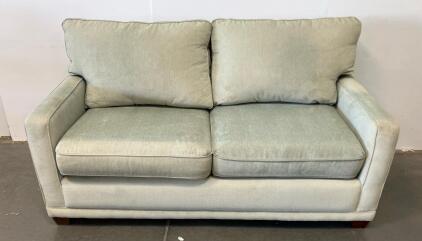 Light Green Loveseat with Track Arms and Wooden Legs, 57" W x 34.5" D x 38.5" H (Conex 1)