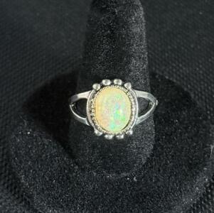 Oval Cabochon Opal Ring with Bezel Setting and Decorative Bead Border
