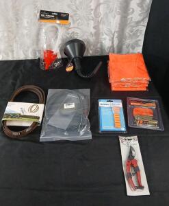 (1) 130969-K Lawnmower Belt, (1) 2-Pack Of 183281 Lawnmower Engine Zone Control Cables, (2) Utility Funnels, (4) Pair Of Earplugs, (1) Pair Of Garden Shears, (1) Ratchet Tie Down Strap & (5) Orange Safety Vests