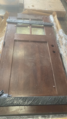 Dark Wood Exterior Door With Molding