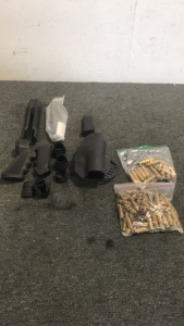 (1) Bag Of .260 Win Brass (1) Bag Of .308 brass (1) Hogue Holster (1) Lot Of Various Mossberg Shotgun Accesories (1) Glock Magazine