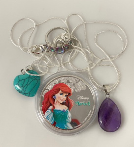 Disneys “Ariel” Collectible Coin, Size 5.5 Topaz Rainbow Ring and (2) Necklaces